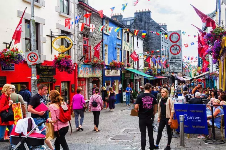 Street scene in historic Galway. This medieval coastal city is now a lively cultural center and popular tourist destination.
